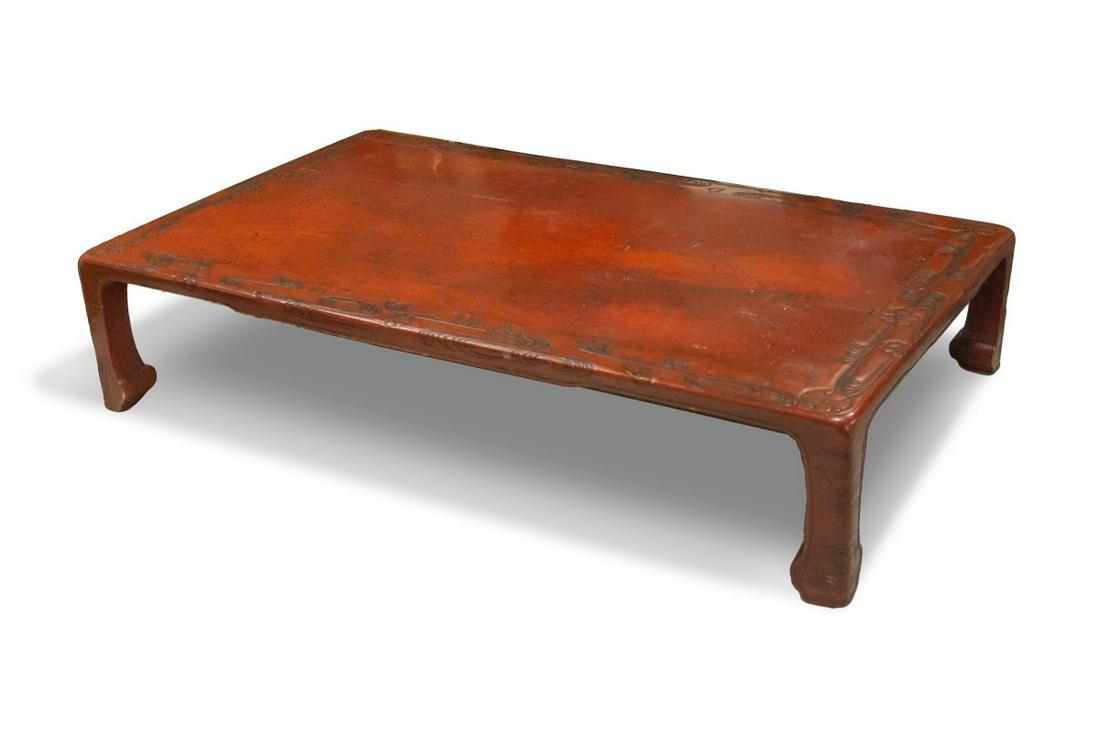 CARVED LOW TEA TABLE: H:12 3/4in(32.3cm) W:68in(172.7cm) D:34in(86.3cm)