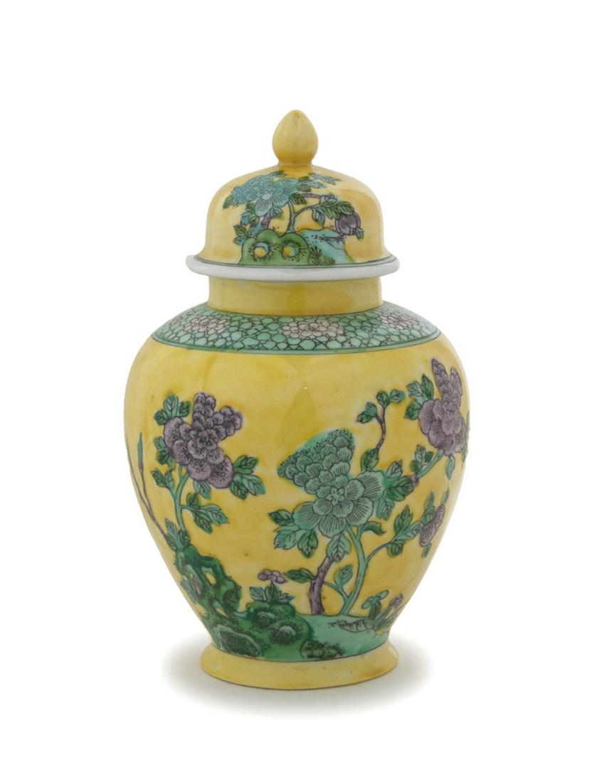 A YELLOW GROUND LIDDED FLORAL JAR (1 of 3)