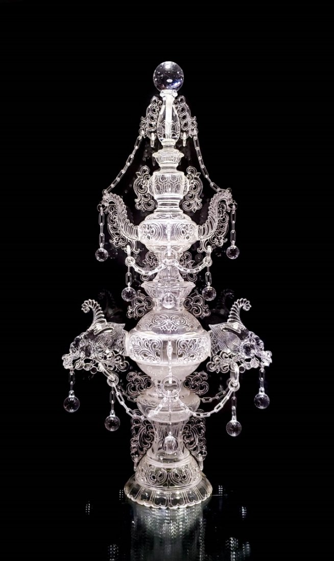 LOT 78 FORMED GLASS DRAGON INCENSE BRAZIER: Eighteen karats yellow gold Eska watch. The dial is square with a gold-tone. It has black hour numbered time markers with black hour and minute hands and no seconds. The crystal is secured by a polish