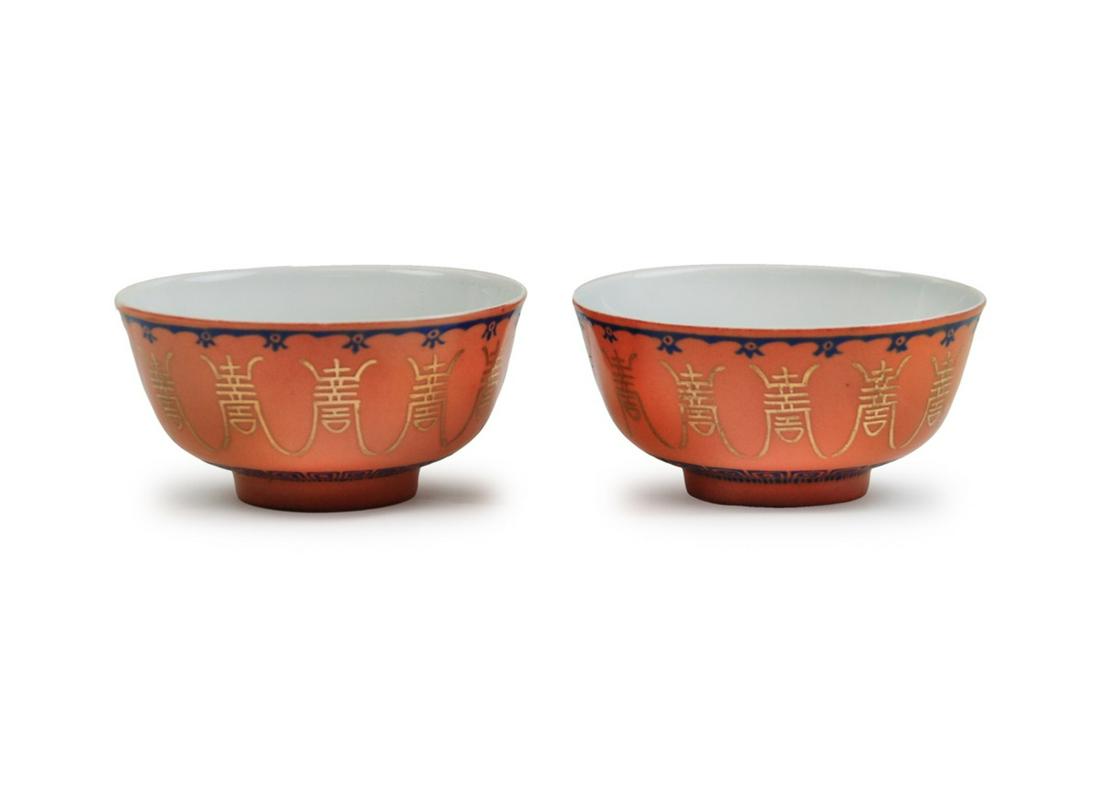 PAIR OF CHINESE CORAL-RED GROUND TEA CUPS: H:2 1/4in(5.7cm) D:4.5in(11.4cm)