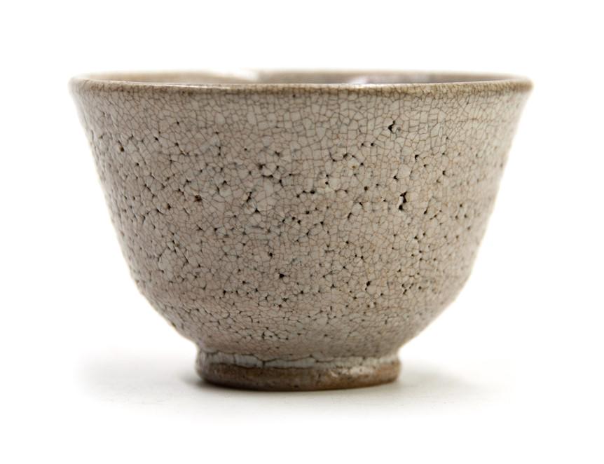 KOREAN YI PERIOD CUP: A small Korean porcelain cup covered in a crackled glaze. H:1 7/8in D:3in