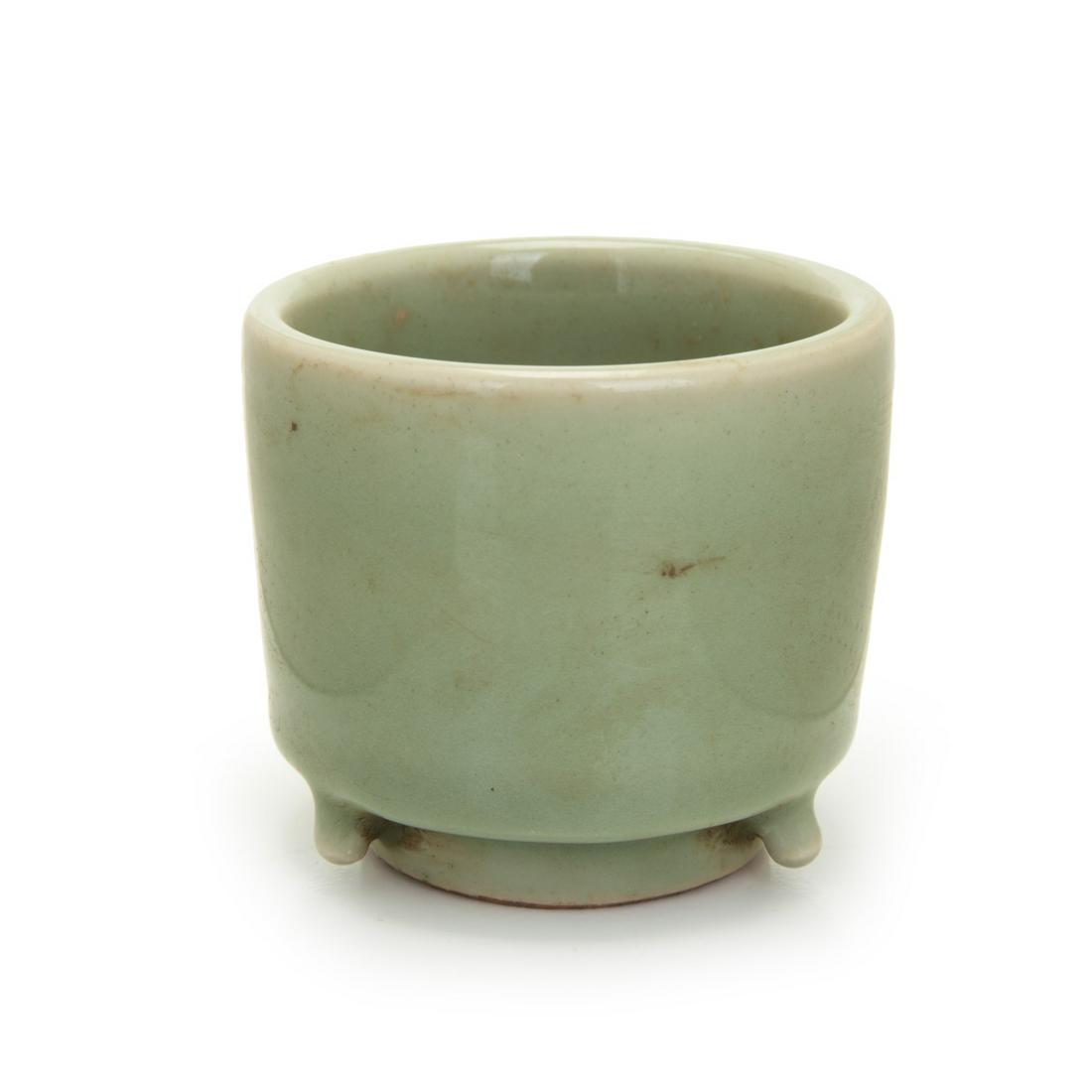 CHINESE CELADON TRIPOD BRAZIER: Chinese celadon tri pod brazier. H:3in(7.6cm) W: 3.25in(8.2cm)