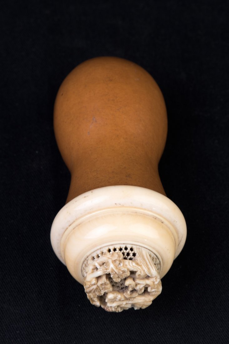GOURD-SHAPED CRICKET HOLDER: A gourd-shaped cricket holder with an ivory top; L: 4 3/4’’