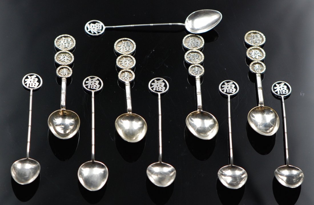 SILVER SPOONS: A silver spoon set with the handles depicting auspicious Chinese characters including ¡°bliss,¡± ¡°good fortune,¡± and ¡°longevity.¡± 3" & 4"
