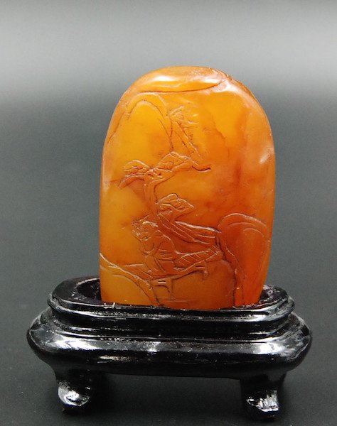 PAGODITE CARVING: Carved soapstone depicting a scene of a man in the mountains. A stand is included. H: 3 _¡± W: 3 _¡±