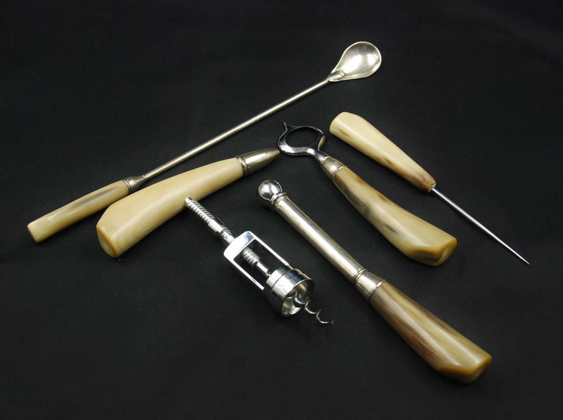 BONE BARTENDING SET OF 5: This bone bartending set comes with a stirring spoon, ice pick, cork screw opener, muddler, and a bottle opener.