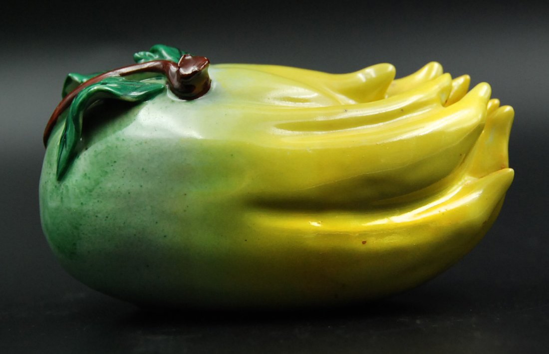 SU SANCAI CITRUS HAND: Glazed in the classic egg and spinach San Cai colors, this porcelain citrus hand is one of a kind. L:5 W:3 H:3