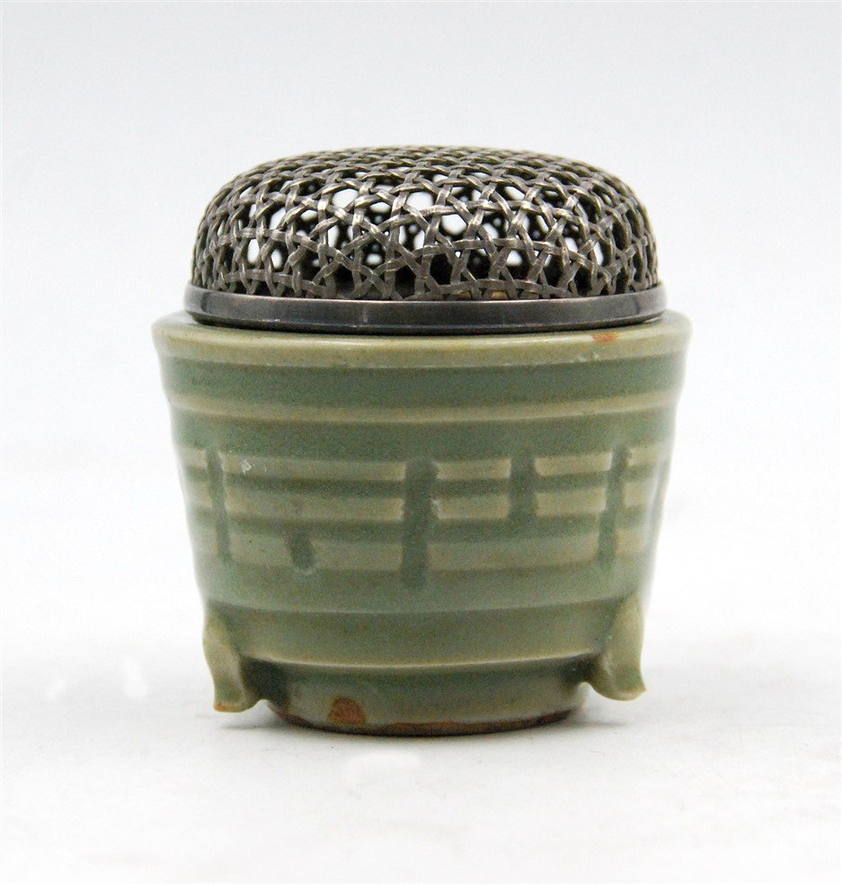 JAPANESE LIDDED CELADON INCENSE BURNER: Topped with a metal basket weave lid, this celadon incense burner has been simply decorated. H:3