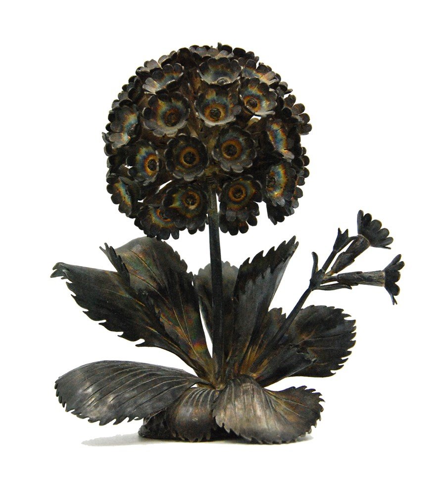 JANNA THOMAS STERLING FLORAL ARRANGEMENT : Similar to a hydrangea flower, this floral arrangement has a polychrome wash. H:4.5 W:4