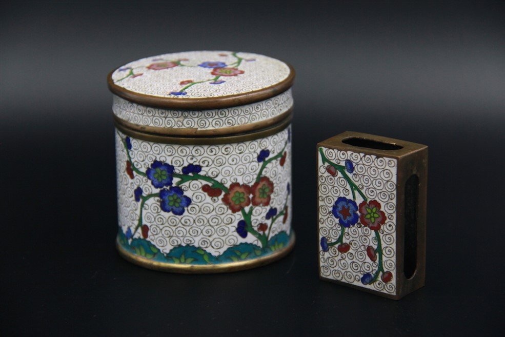 CLOISONNE ENAMEL SMOKING SET: Made of bronze with cloisonné enamel decorations; a cigarette box and a matchbox; H: 3 1/4