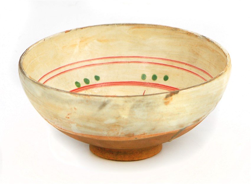 MING DYNASTY FIGURAL BOWL: Covered in a white glaze stopping at the base