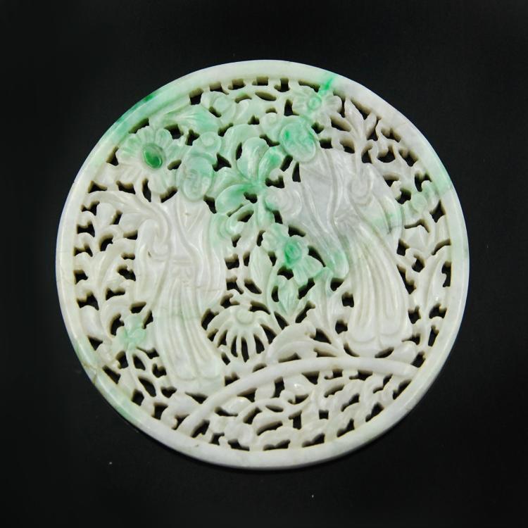 JADEITE PLAQUE: A circular jadeite plaque carved in openwork patterns featuring two women holding flowers. D:4in 98g
