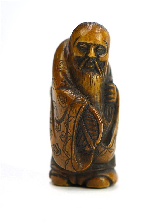 EDO DYNASTY (1615?1868) JAPANESE NETSUKE BONE OLD MAN: This netsuke has been carved in the image of a longevity god.