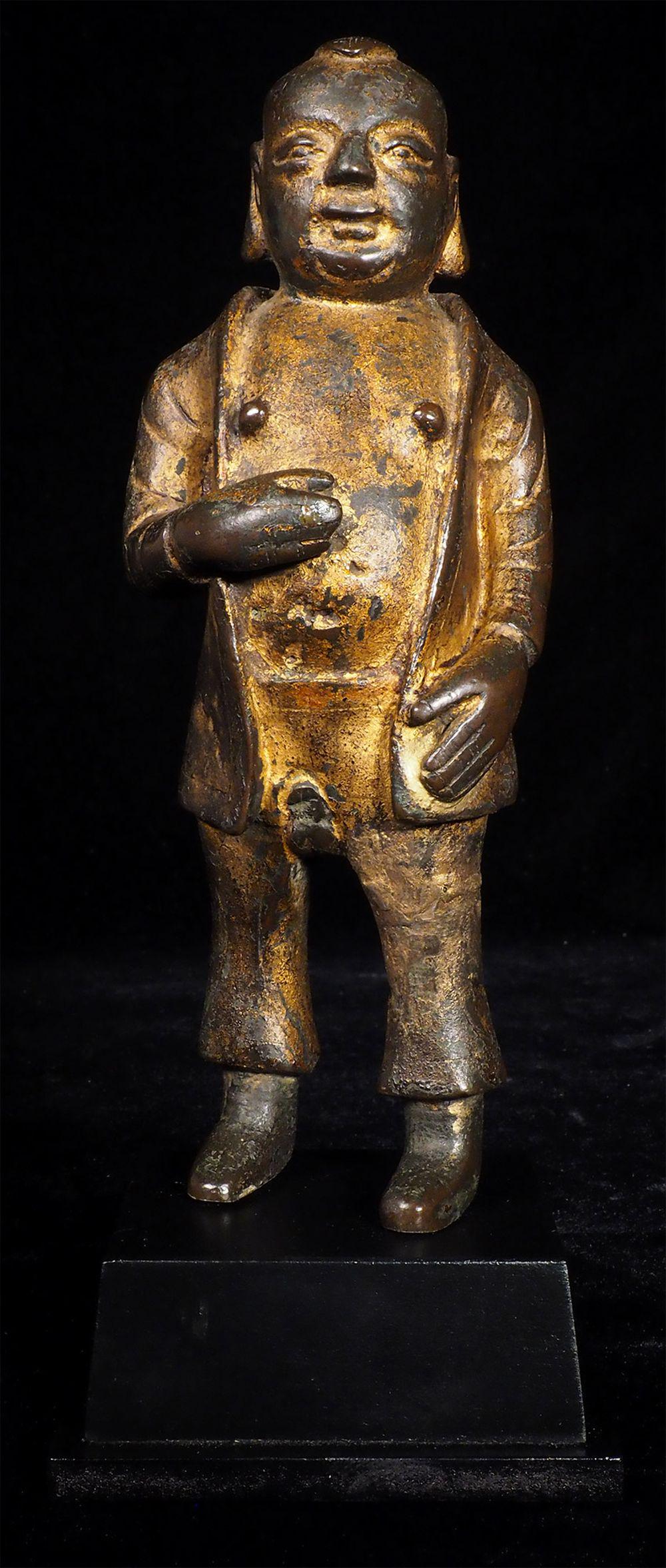 Very uncommon MingChing bronze figure-head, face, and: Very uncommon MingChing bronze figure-head, face, and body shape look like a Ming era "Baby Buddha" (related to items 5021 and 5625 on my site), though he is wearing non-buddhist western attire, and m