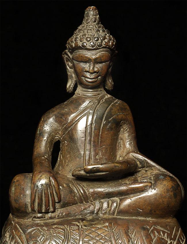 A very fine 17/18thC or earlier Cambodian Buddha with a: A very fine 17/18thC or earlier Cambodian Buddha with a wonderful face, base, and patina. This piece measures 5" tall.