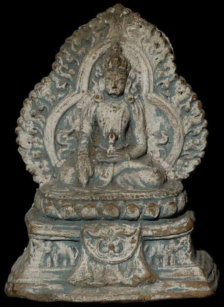 Centuries old Tibetan Votive. Apparently came out of: Centuries old Tibetan Votive. Apparently came out of Tibet in 1959 with Tibetan refugees. 3.75" tall, 3" x 2" on bottom of base.4" tall, base measures 3" x 1.75"