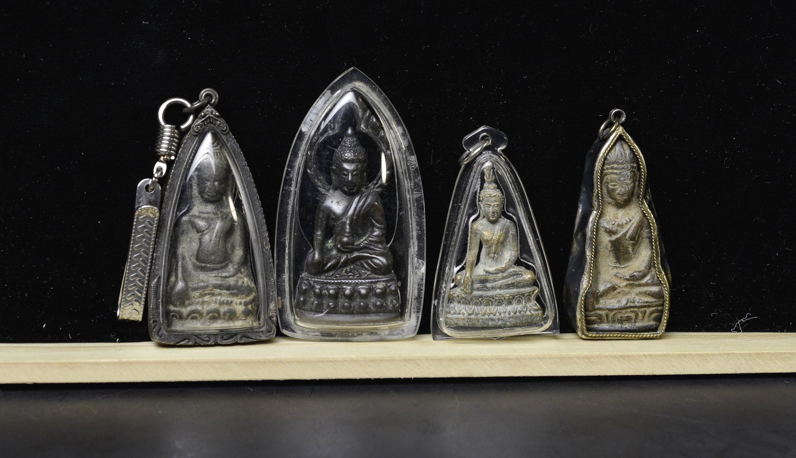Box Lot #4 This lot consists of 4 Thai, Or Cambodian amulets in modern amulet cases.: Box Lot #4 This lot consists of 4 Thai, Or Cambodian amulets in modern amulet cases. It is hard to tell whether these amulets have age or are modern emulations. Most are 20th century, there may be an 