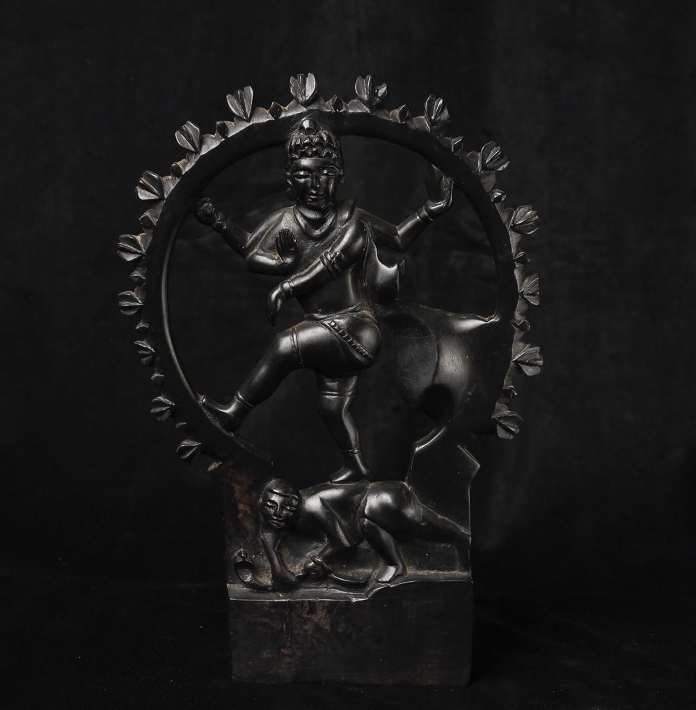 Indian Shiva Nataraj is carved out of black wood as hard and heavy as metal or stone. (1 of 9)