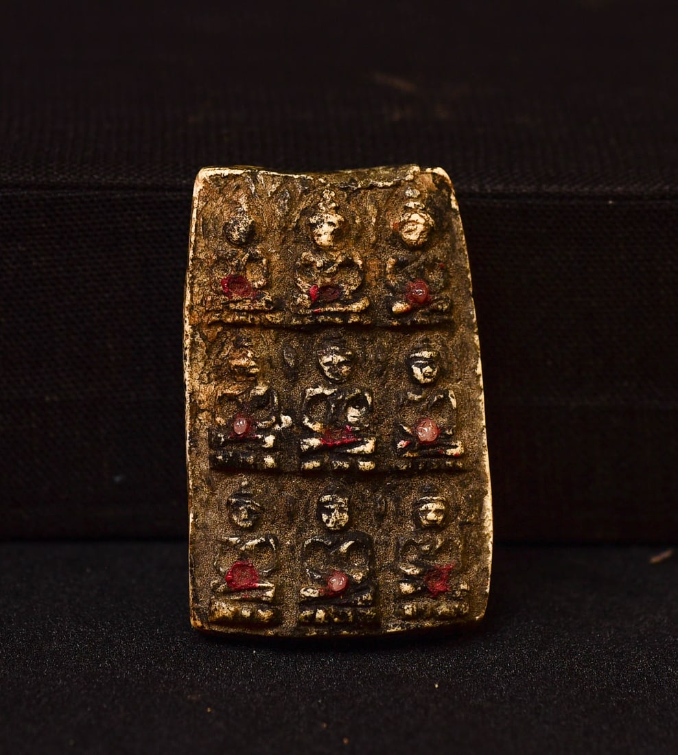 Remarkable old amulet carved out of bone with tiny inset gems (rubies?).: Remarkable old amulet carved out of bone with tiny inset gems (rubies?). Never seen another like it!! Starting Price was lowered. Long time personal favorite.