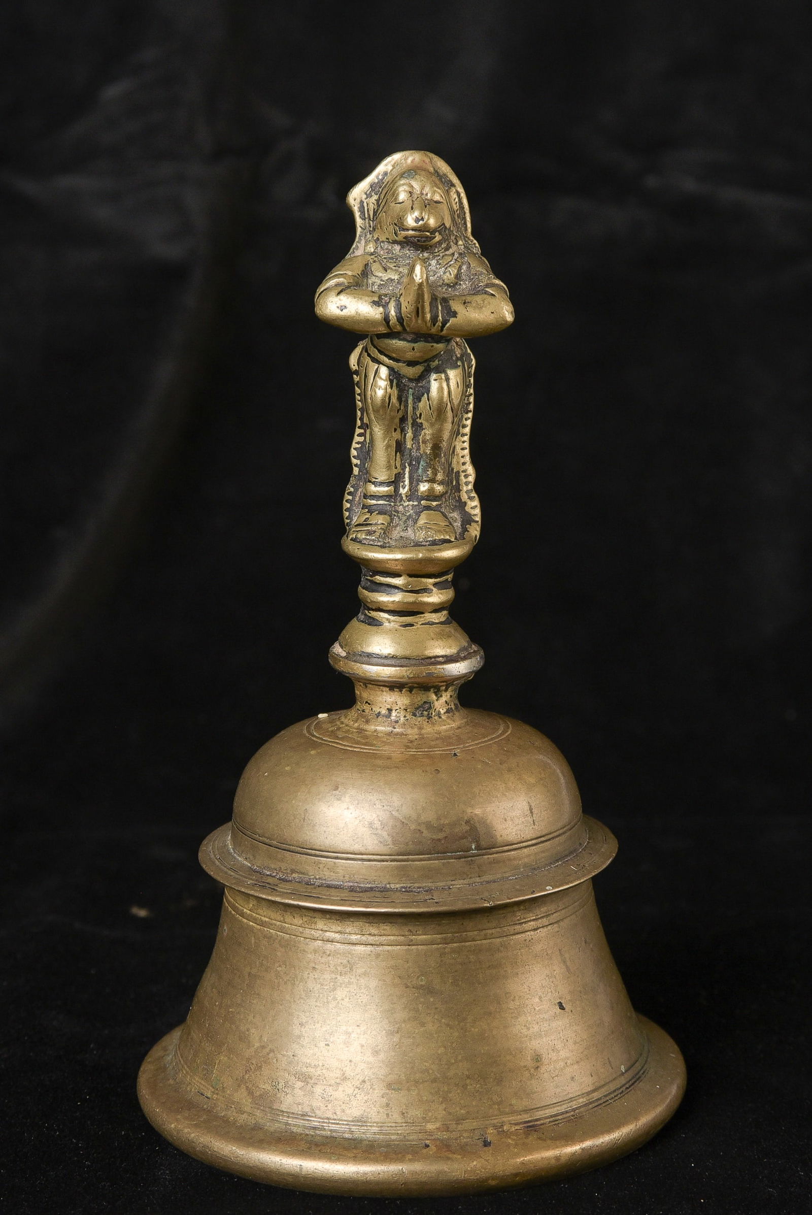 18th century Indian Hindu Bronze Bell.: 18th century Indian Hindu Bronze Bell. A beautifully made Hanuman sculpture adorns the top of the bell as a handle. It is Hanuman as the Spirit of Service. Just look at his face. The wear makes him ge