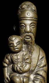 Unusual antique Chinese bronze holding a baby. Measures