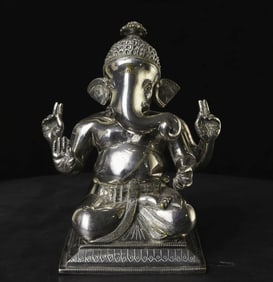 Antique silver over bronze Ganesh from India. Extremely finely cast and finished.