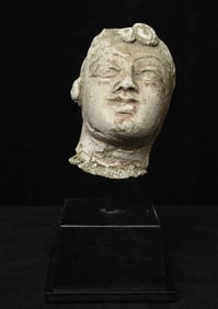 2-4thC Gandharan head made of stucco on a custom base.