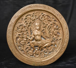 Antique Indian figure sculpted into a pierced copper plate.