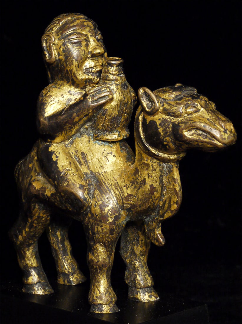 Early figure on camel. South China?Mongolia?. Finely modeled/cast/gilded.-starting price cut in half