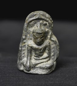 True Pagan Buddha Amulet thickly cast out of a lead alloy, mounted on a custom base.