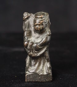 Very old solid cast bronze figure.