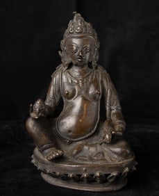 This is a delightful sculpture of Jambahala.? It is from Nepal, early 20th century.?