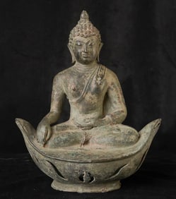 18 /19 century or earlier northern Thailand, Lanna style Buddha sitting on a boat shaped base.