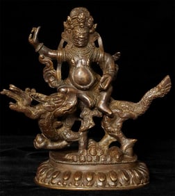 Antique Solid-cast Mongolian deity on dragon.