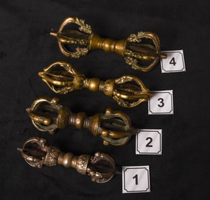 Four bronze (or other metal alloys) Mongolian Dorjes. They each appear to have iron cores. Collected