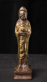 Chinese Liao-style Bronze Buddha with silvered face and gilded robes.