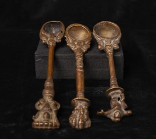 Three cast 18/19thC Indian Hindu bronze ritual spoons for one bid.