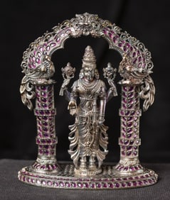 Find miniature Hindu shrine with artificial rubies. Beautiful.