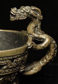 Antique bronze ceremonial cup in an archaic form