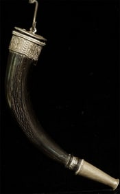 Antique Asian horn with what appear to be silver alloy mounts.