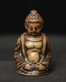 Fascinating antique solid-cast Buddha-like figure.
