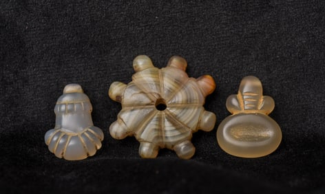 Three small antique Himalayan (or nearby) miniature carved stone objects.