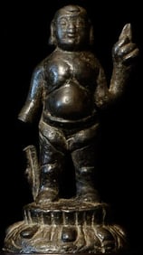 Very early folk style Baby Buddha pointing towards the