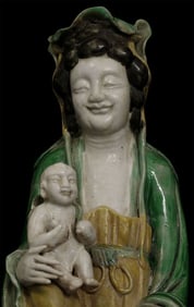 Superb Ching porcelain Quanyin with baby. One of the