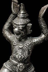 Powerful presence to this solid-cast silver Hanuman on a silver repousse base, circa 1900.