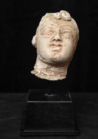 2-4thC Gandharan head made of stucco on a custom base.