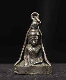 18thC Solid Silver Cambodian Buddha in a silver amulet holder that allows it to be worn.