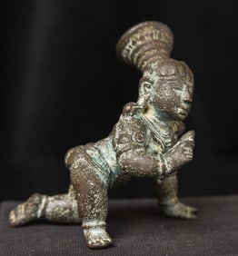Nice early bronze baby Krishna with his butterball.