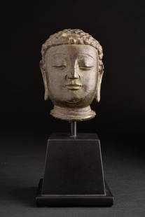 Chinese Bronze Buddha Head-solid cast, possibly 12 to 14 century. Fine example of.: Early Solid-Cast Chinese Bronze Buddha. While it has some characteristics in common with the Ming style, I believe it is several centuries. This piece measures 3 3/4" tall and 7 1/5" on its custom bas