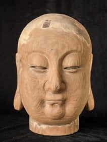 Large Buddhist wood monk head carved out of a solid piece of wood. Probably 20th century.